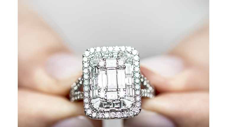 Woman Holding a Diamond Ring