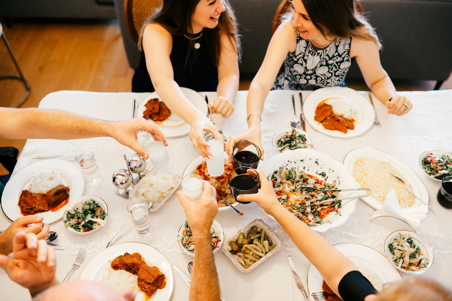 Close up of friends having fun and toasting and celebrating with turkish rakı