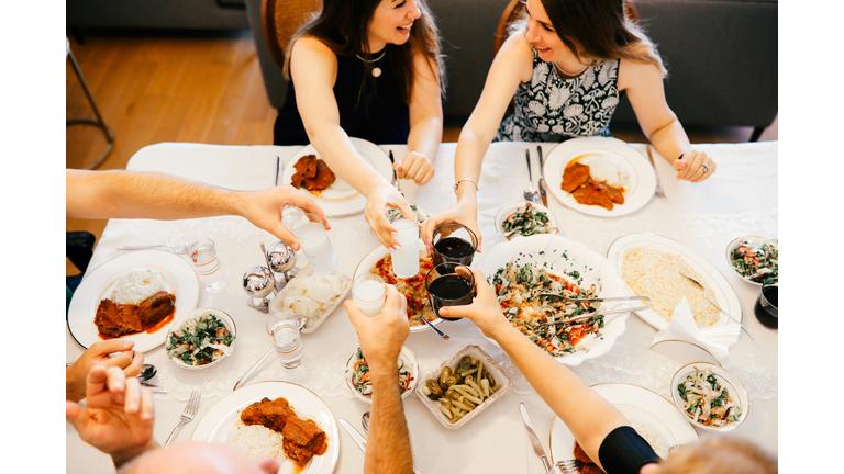 Close up of friends having fun and toasting and celebrating with turkish rakı