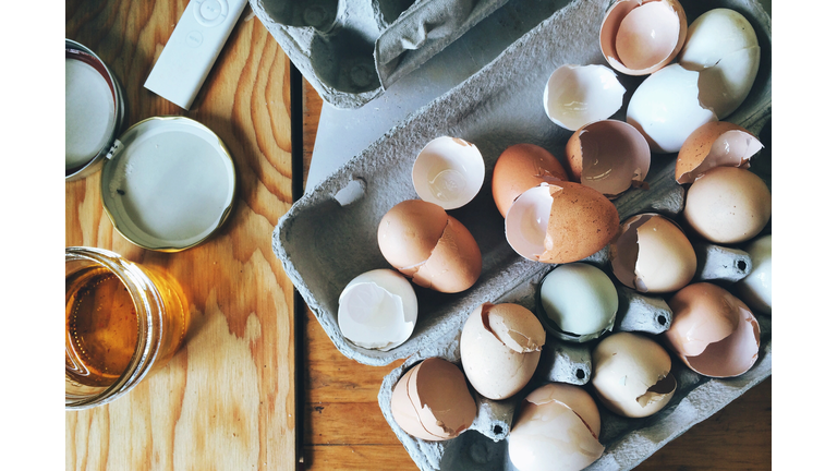 Directly Above View Of Eggshells In Carton On Table
