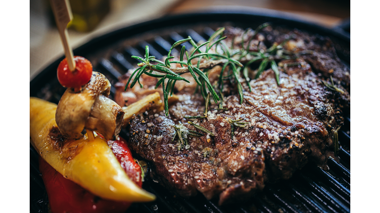 grilled beef steak or rump steak on steel tray