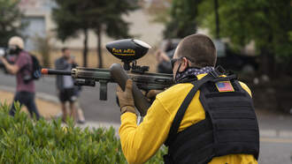 Security uses a paintball gun to break up a fight at this High School.