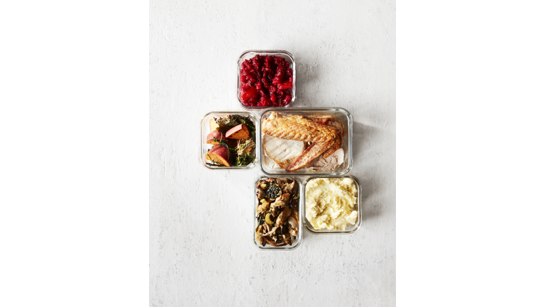Thanksgiving Leftovers in Containers on White Wood