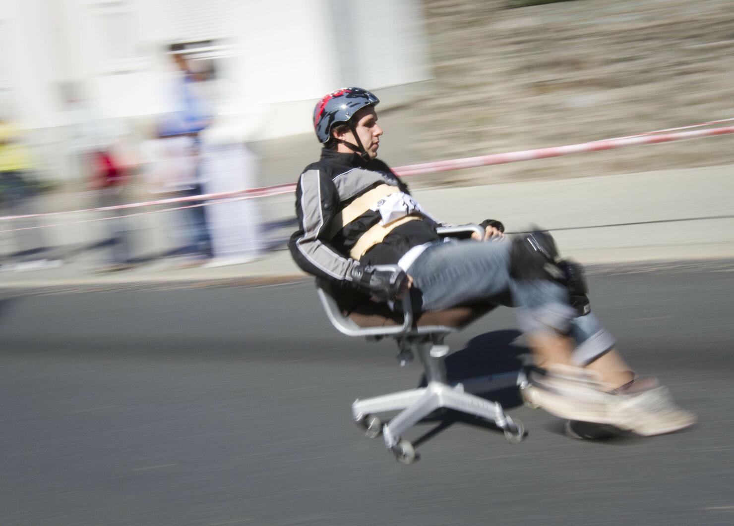 A competitor races down a street on his