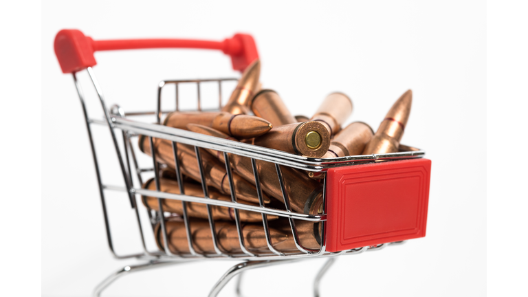 Closeup of small shopping cart with ammunition inside. 7.62x39 rifle bullets.