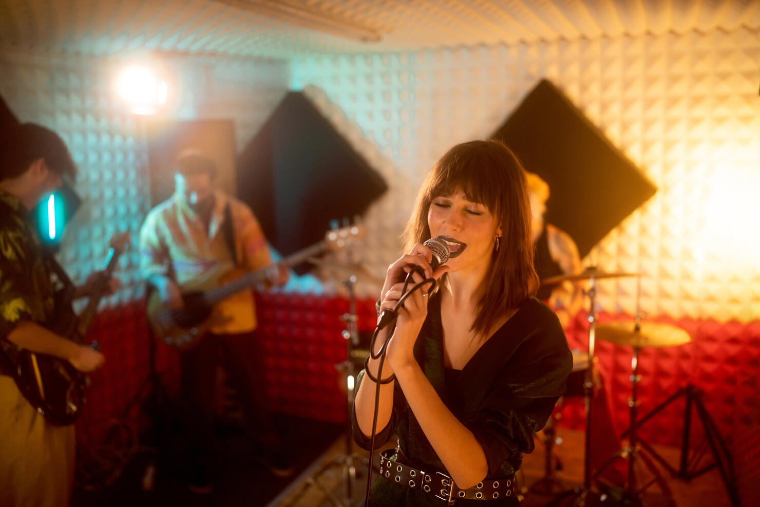 Rock band having rehearsal at the music recording studio