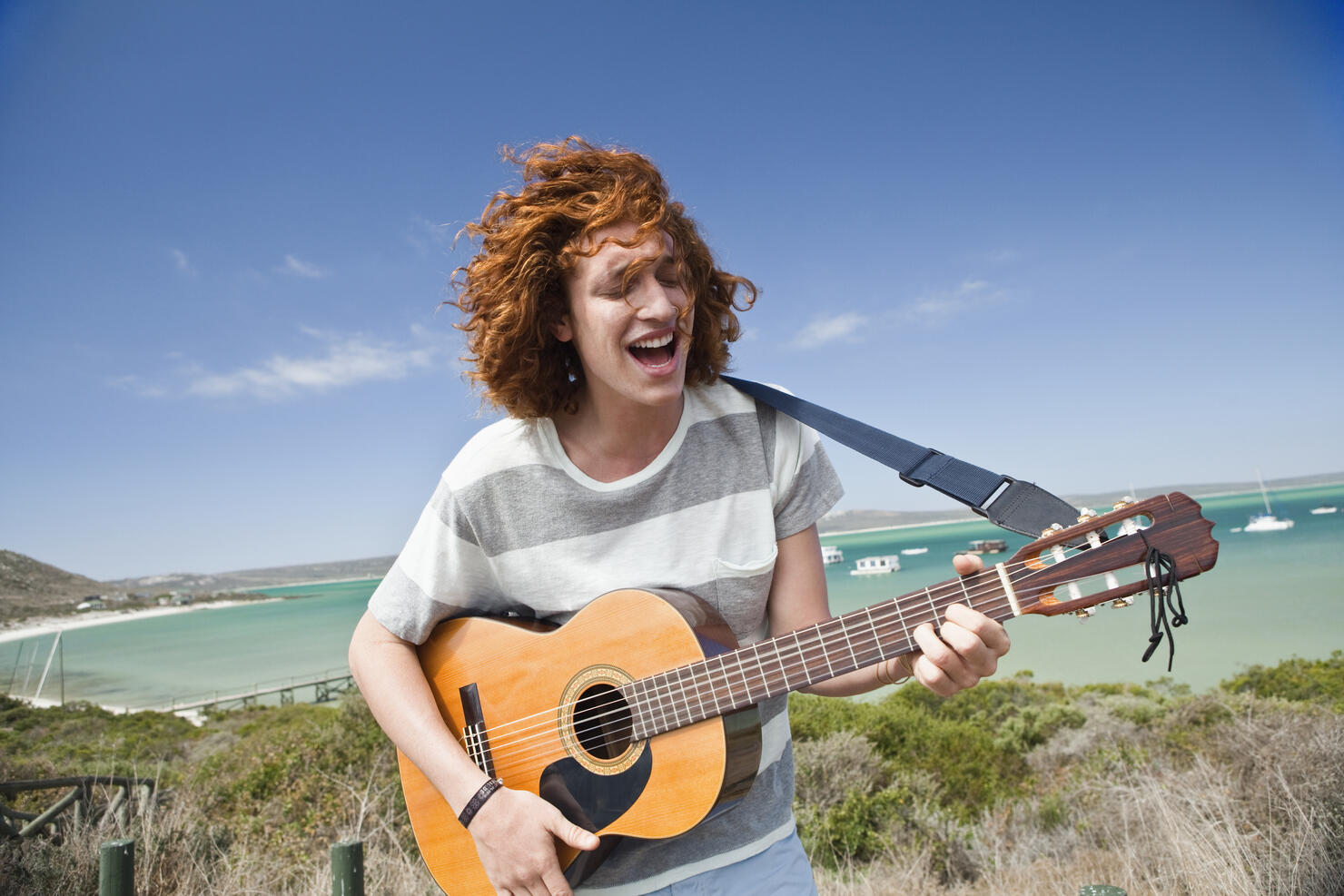 Man playing guitar outdoors