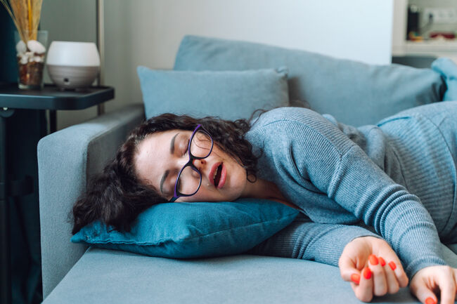 Woman sleep at home on a sofa