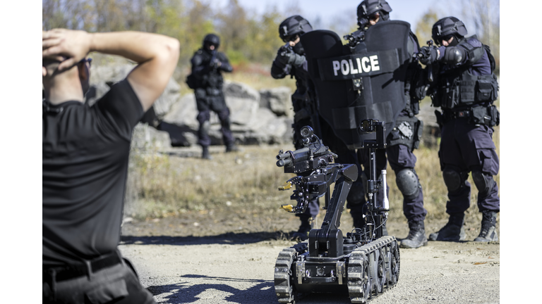 Police Swat Team Officers Using a Mechanical Robot Unit