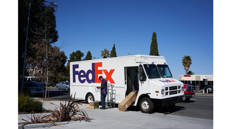 FedEx Delivery Driver Sorting Packages