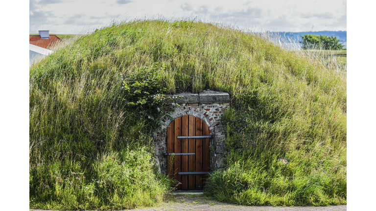 A hut in the ground under the grass in Denmark.