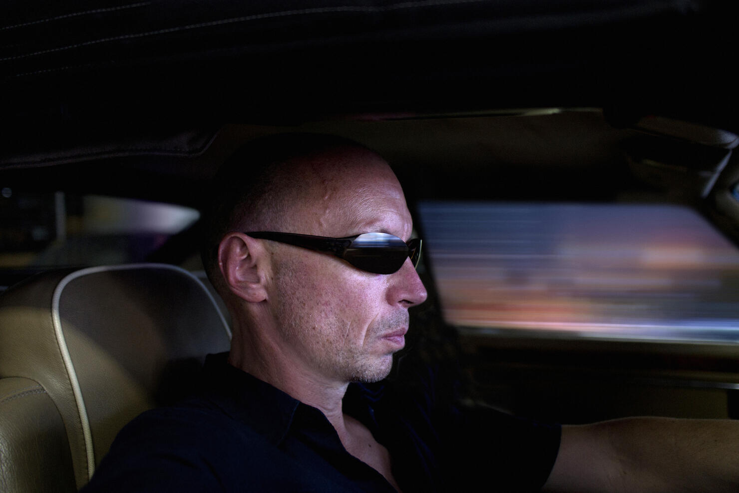 Portrait of a man driving a car.