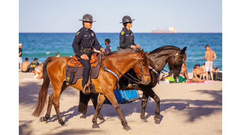 Police on horses on patrol in Fort Lauderdale Beach Spring Break