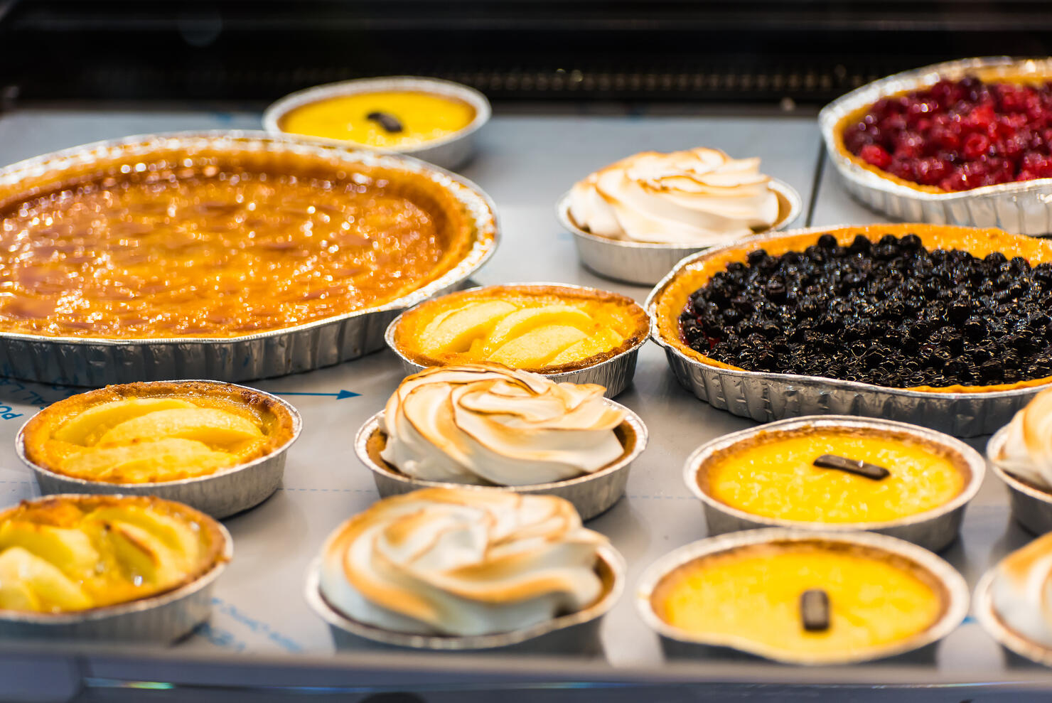 the counter of the cafeteria with different desserts