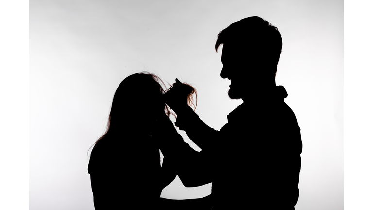 Silhouette Couple Standing Against White Background