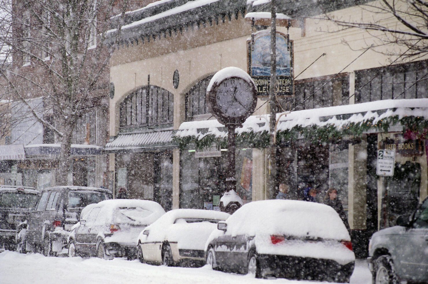 Heavy snow falling on city street