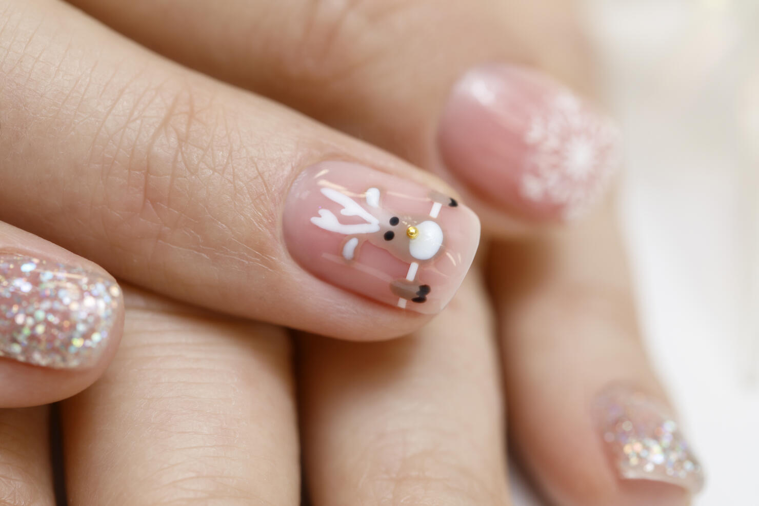 A Christmas reindeer on a natural pink is understated but fun!