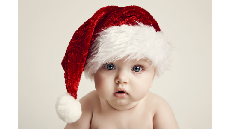 Beautiful baby wearing Santa hat