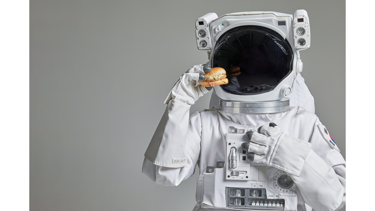 An Astronaut with a Hamburger