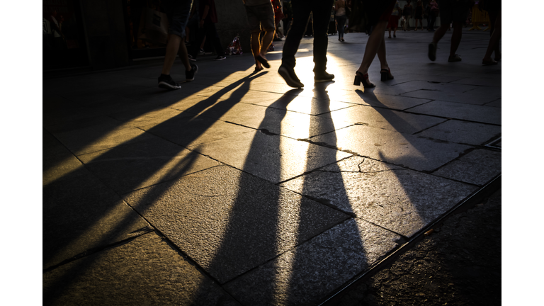 Low Section Of People Walking On Footpath