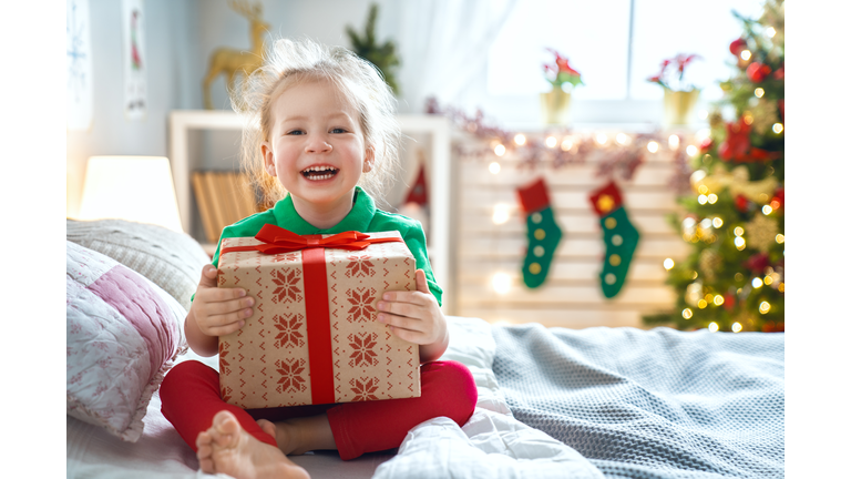 child opening Christmas present
