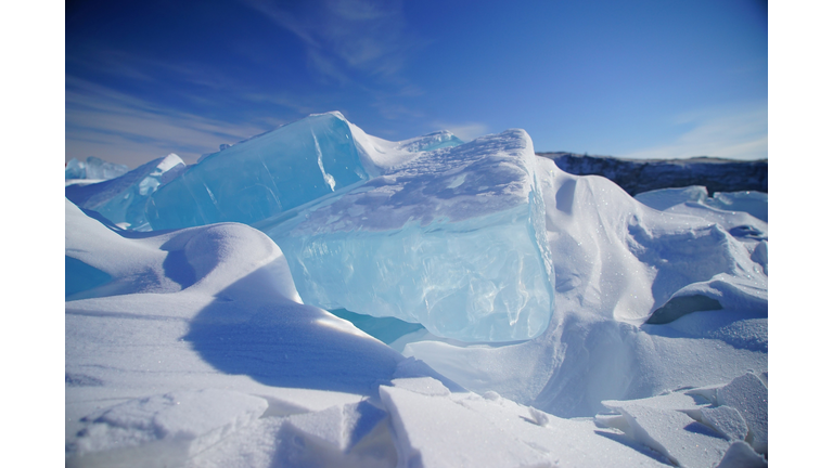 Scenic view of snowcapped mountains and ice formations.