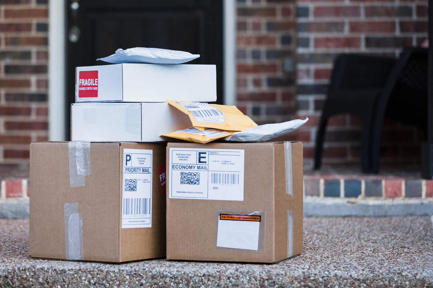 Packages for delivery or pick up on front porch