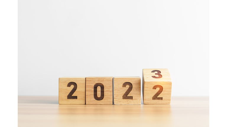 2022 change to 2023 year block on table background. goal, Resolution, strategy, plan, start, budget, mission, action, motivation and New Year concepts