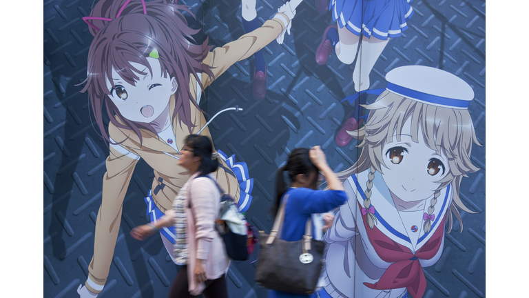 Young Women and Anime Mural on Central Avenue in Akihabara Electric Town District of Tokyo, Japan