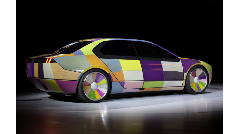 The BMW i Vision Dee concept car, showing different colors on it's 240 individual panels.