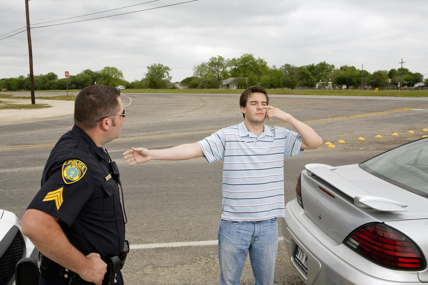 Police officer taking sobriety test of man