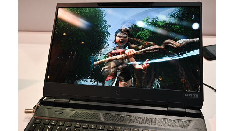 Close-up of a laptop with a video game on the screen.