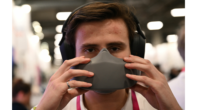 Man wearing a gray voice privacy mask.