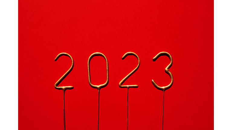 Year number 2023 over red background. Happy new 2023.