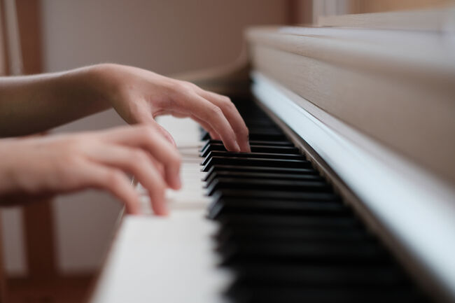 Close up hands playing piano