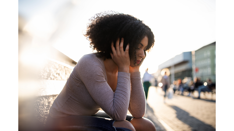 Unhappy young woman feeling low