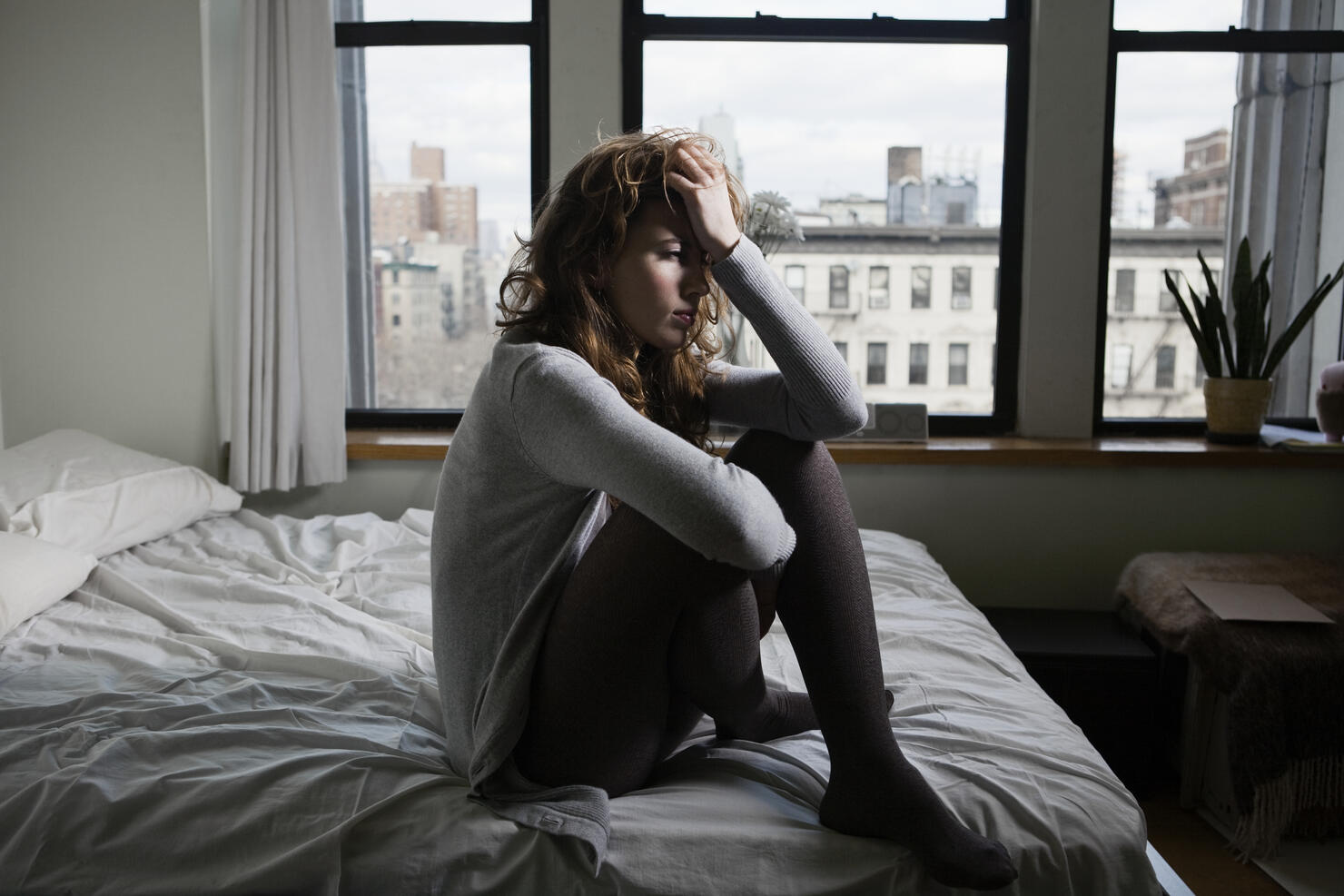 Lonely Woman in Bedroom