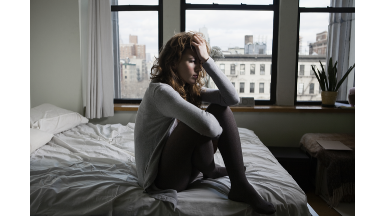 Lonely Woman in Bedroom