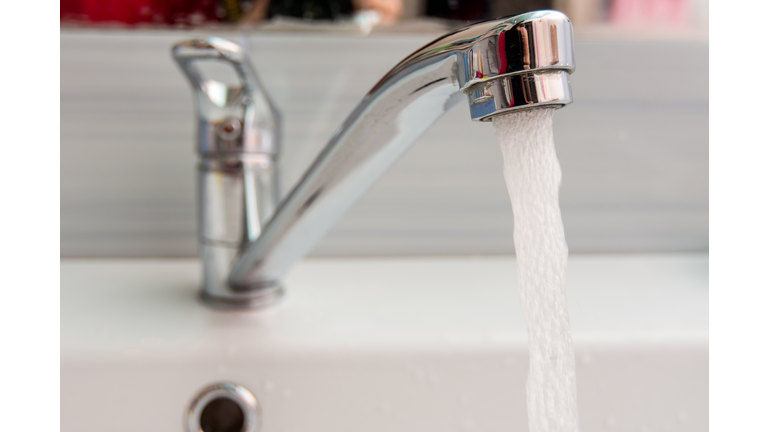 Water pours more pressure from the mixer in the bathroom