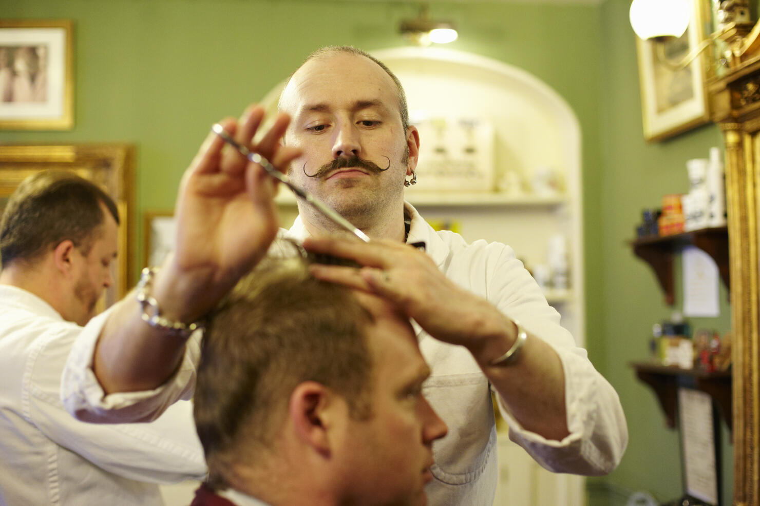 Barber cutting customers hair