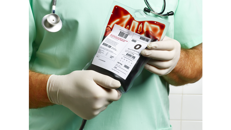 Doctor/ Nurse holding blood bag.