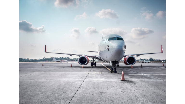 Airplane On Runway Against Sky