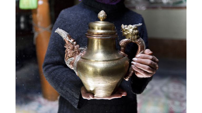 Woman with tea pot