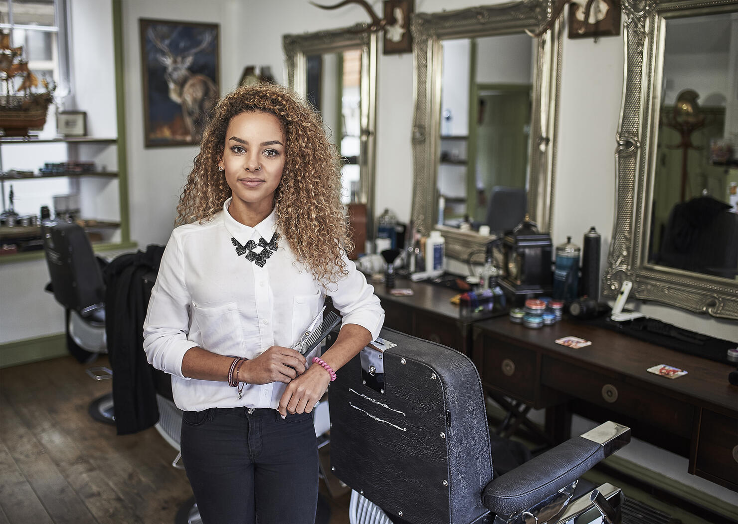 Portrait of young female barber
