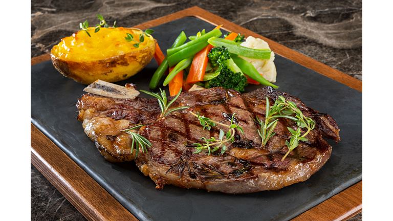 Grilled Steak with Prepared Potato and Steamed Vegetables