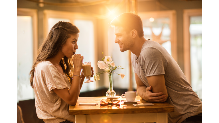 Young couple in love spending time together in a cafe.