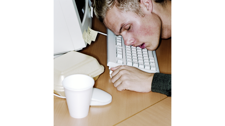 Man asleep at computer