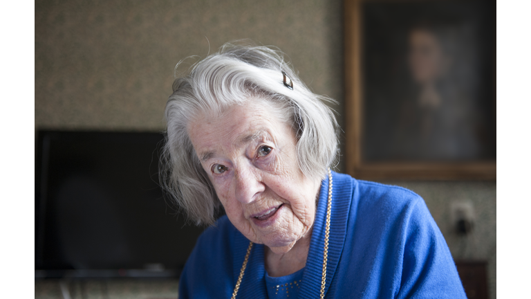 Portrait of a 99-year-old woman at home