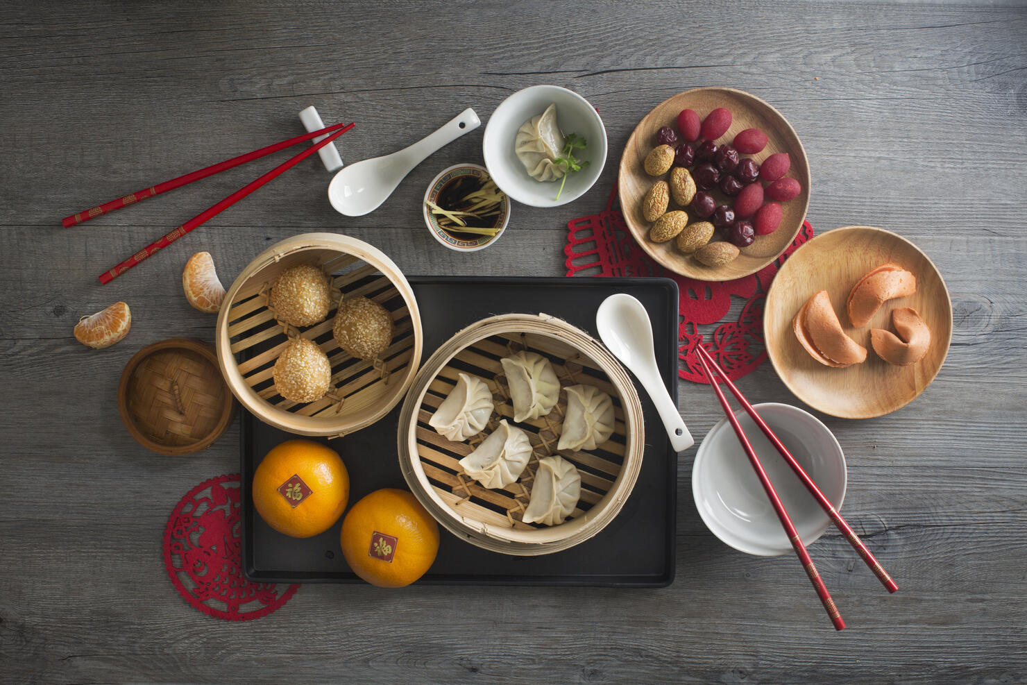 Chinese food steamed dumpling and tea served on rustic wooden background.