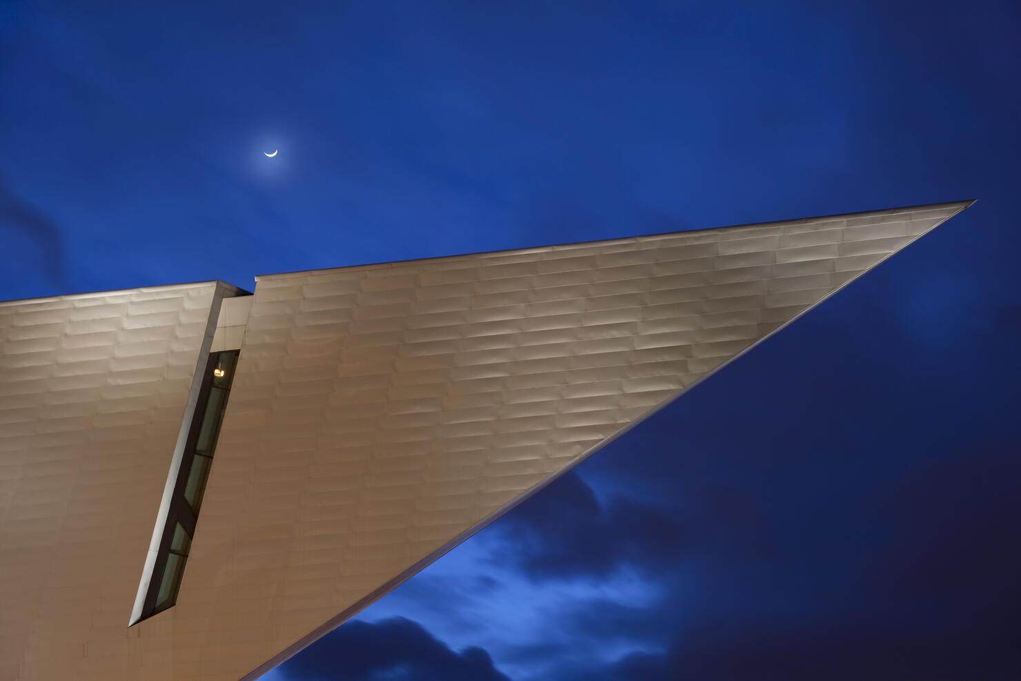 Downtown Denver Art Museum with moon at Night Colorado